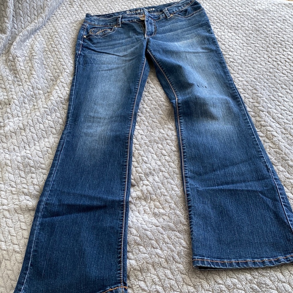 Dark blue denim. Size 8. Bootcut.